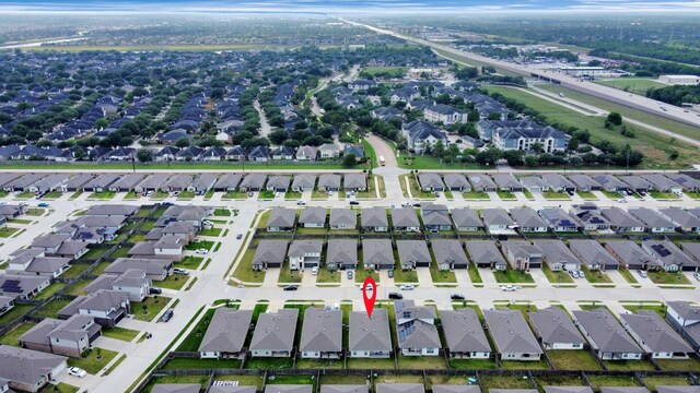 aerial view with a water view and a residential view
