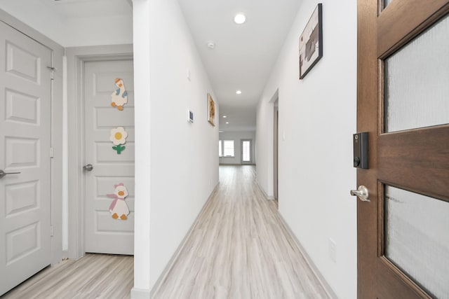 hall featuring recessed lighting and light wood-type flooring