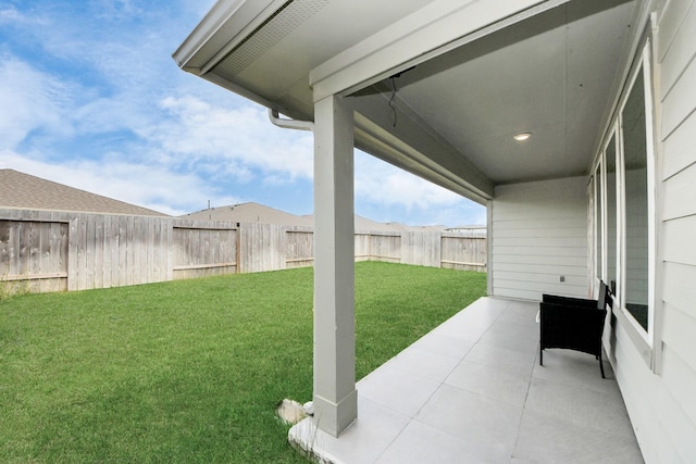 view of yard with a fenced backyard and a patio area