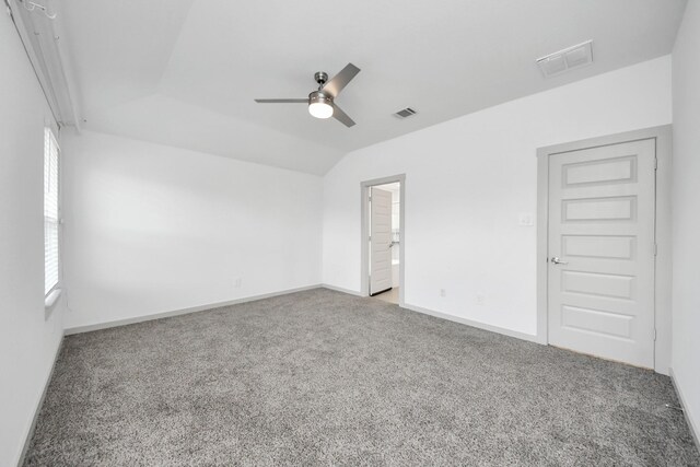 empty room with ceiling fan, carpet, and visible vents