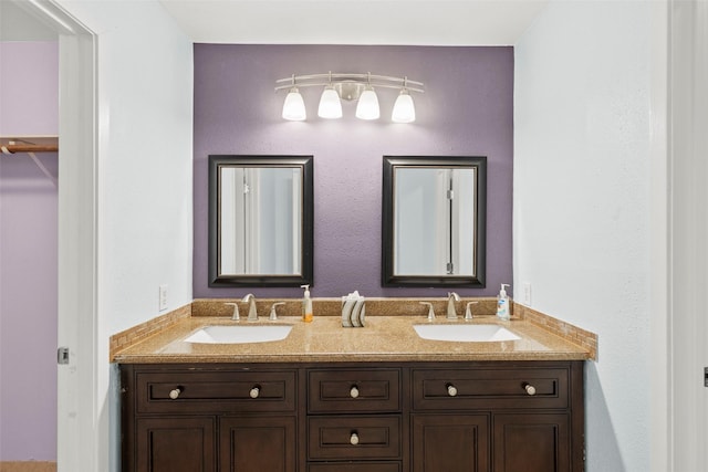 bathroom featuring double vanity and a sink