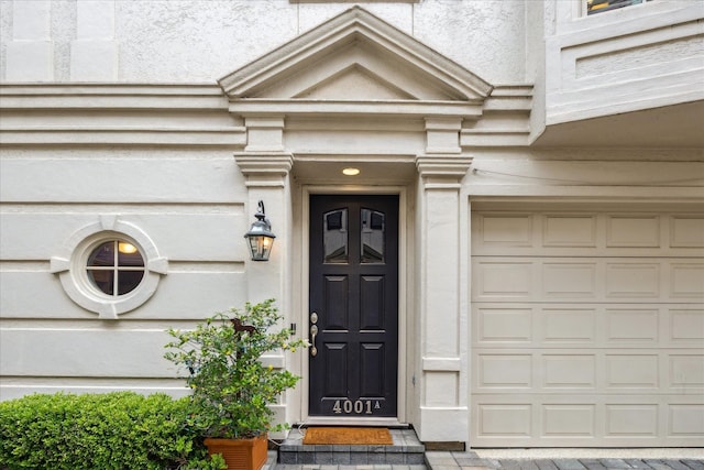 entrance to property featuring a garage