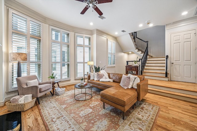 living room featuring visible vents, wood finished floors, stairway, recessed lighting, and a ceiling fan