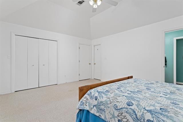 bedroom featuring carpet floors, ceiling fan, visible vents, and vaulted ceiling