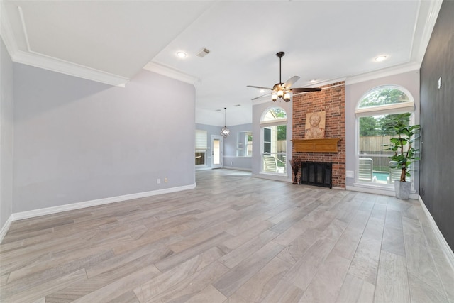 13414 Autumn Valley Dr, Cypress, TX 77429 - unfurnished living room with a brick fireplace, a ceiling fan, crown molding, light wood finished floors, and baseboards