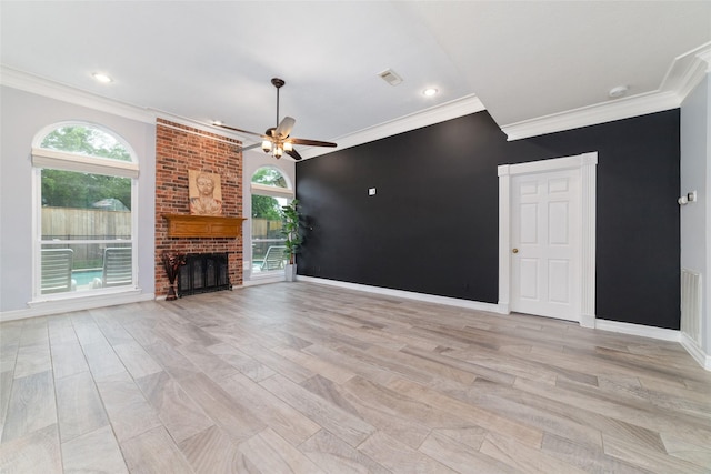 13414 Autumn Valley Dr, Cypress, TX 77429 - unfurnished living room featuring ornamental molding, healthy amount of natural light, a ceiling fan, light wood finished floors, and recessed lighting