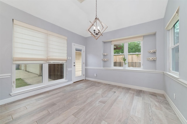 13414 Autumn Valley Dr, Cypress, TX 77429 - unfurnished room featuring a chandelier, wood finished floors, baseboards, and lofted ceiling