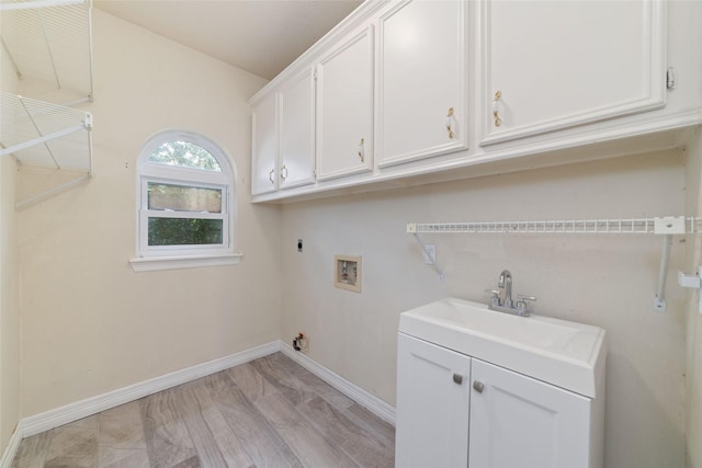 13414 Autumn Valley Dr, Cypress, TX 77429 - laundry area featuring cabinet space, washer hookup, hookup for an electric dryer, and baseboards