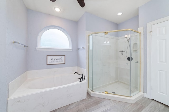 13414 Autumn Valley Dr, Cypress, TX 77429 - bathroom with ceiling fan, a shower stall, and a garden tub
