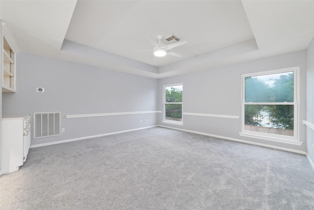 13414 Autumn Valley Dr, Cypress, TX 77429 - spare room with a tray ceiling, ceiling fan, carpet floors, and baseboards