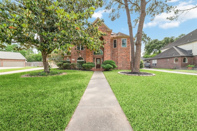 13414 Autumn Valley Dr, Cypress, TX 77429 - traditional-style house featuring brick siding and a front lawn