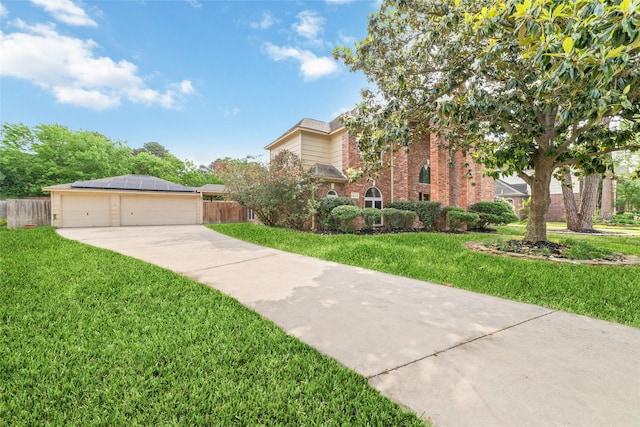 13414 Autumn Valley Dr, Cypress, TX 77429 - view of front of house featuring brick siding, solar panels, and a detached garage