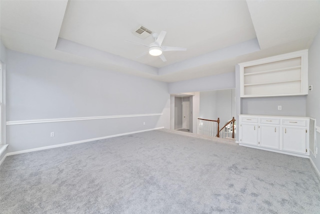 13414 Autumn Valley Dr, Cypress, TX 77429 - unfurnished living room with a tray ceiling, ceiling fan, carpet floors, and baseboards