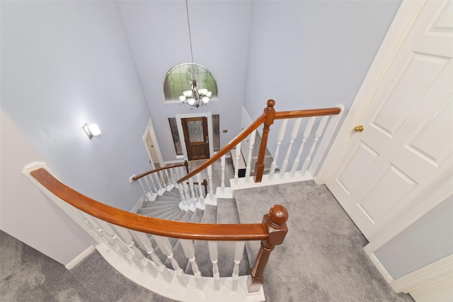13414 Autumn Valley Dr, Cypress, TX 77429 - staircase featuring carpet floors, a chandelier, a towering ceiling, and baseboards