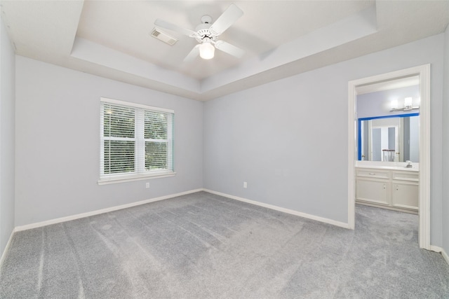 13414 Autumn Valley Dr, Cypress, TX 77429 - carpeted empty room featuring a tray ceiling, baseboards, and a ceiling fan