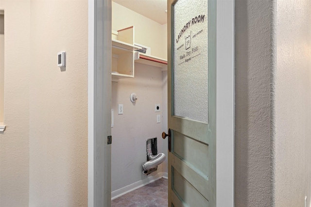 laundry area with baseboards, laundry area, and electric dryer hookup