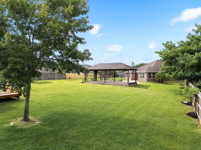 view of yard with a gazebo and a fenced backyard