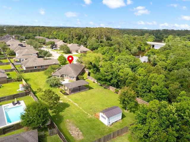 drone / aerial view featuring a view of trees