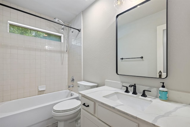 full bathroom with vanity, a textured wall, toilet, and shower / washtub combination
