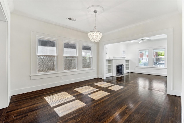 unfurnished living room featuring ornamental molding, dark wood finished floors, and visible vents