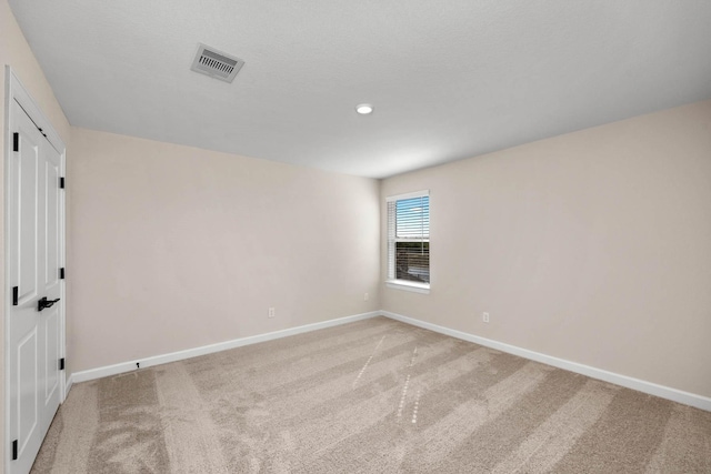 3031 Sunmoon Ln, Katy, TX 77493 - empty room with light colored carpet, baseboards, and visible vents