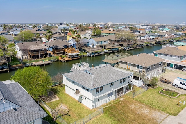 bird's eye view featuring a water view and a residential view