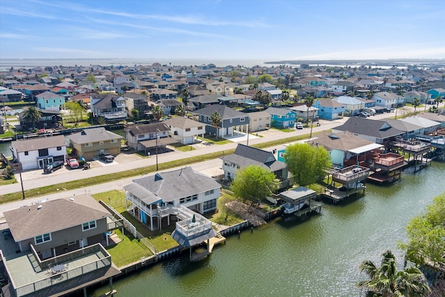 birds eye view of property featuring a water view and a residential view