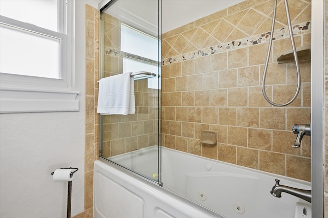 full bathroom featuring a healthy amount of sunlight and a combined bath / shower with jetted tub