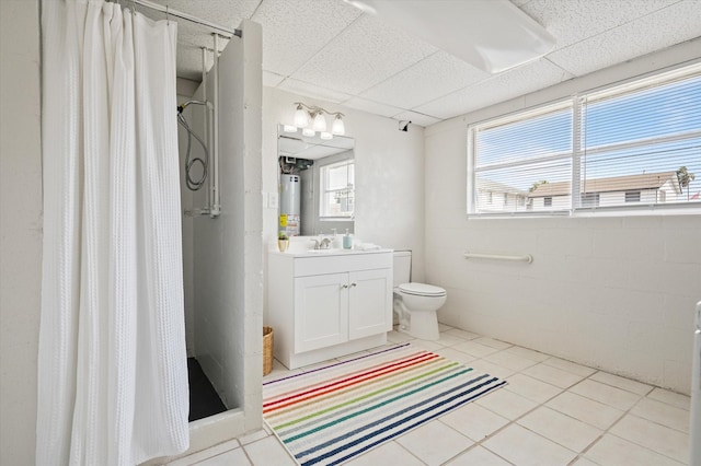 bathroom featuring water heater, a shower stall, a drop ceiling, and toilet