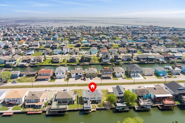bird's eye view with a water view and a residential view