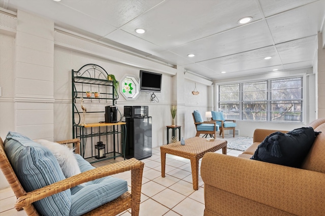 living room featuring recessed lighting and light tile patterned floors