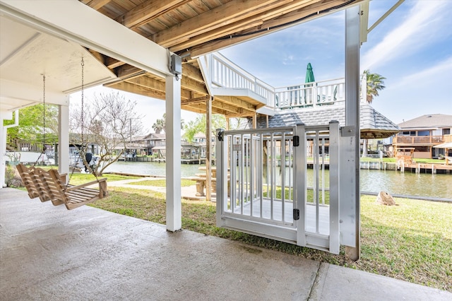 view of patio with a water view