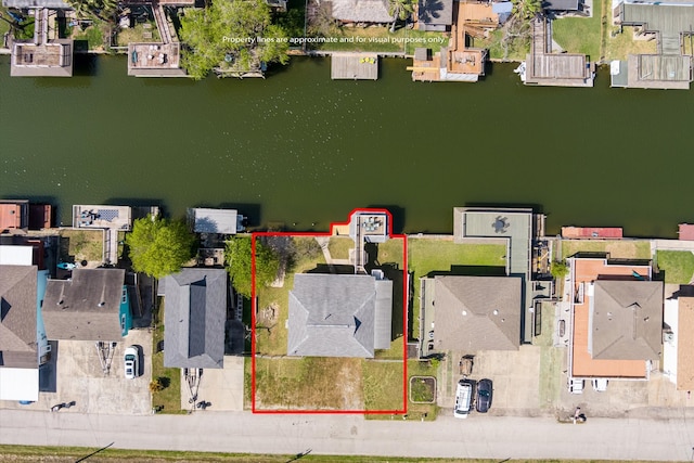 aerial view featuring a water view and a residential view