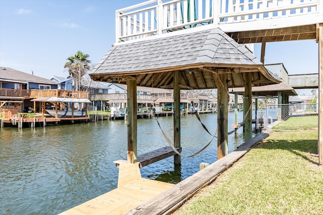 dock area featuring a water view and fence