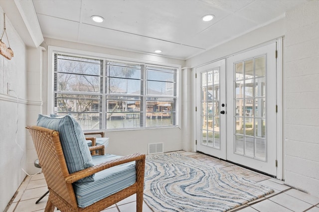 interior space with french doors and visible vents
