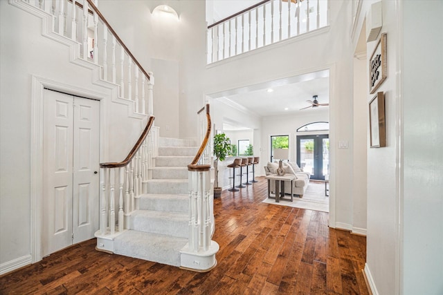 3410 Creekstone Dr, Sugar Land, TX 77479 - entryway featuring dark wood finished floors, a ceiling fan, stairway, crown molding, and a high ceiling