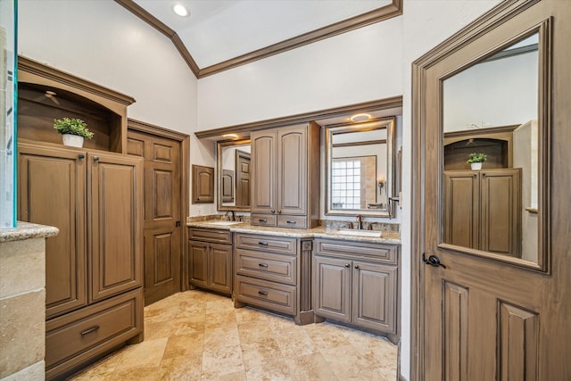 bathroom featuring a sink, double vanity, and ornamental molding