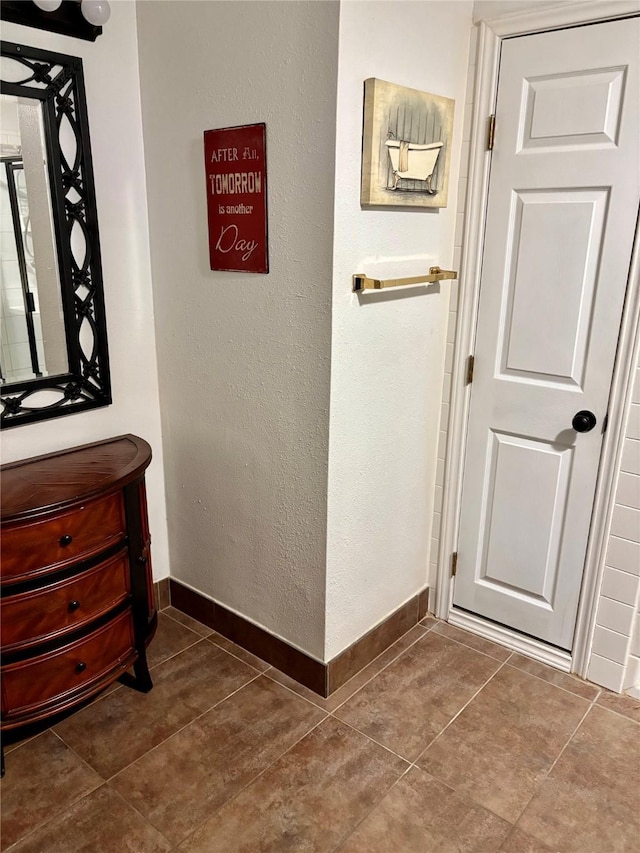 room details with baseboards and a textured wall