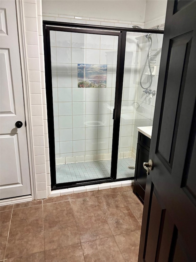 bathroom featuring vanity and a stall shower