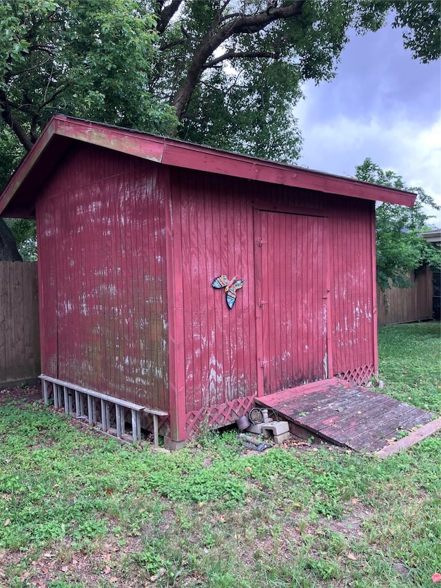 view of shed with fence