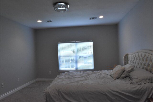 carpeted bedroom with visible vents, recessed lighting, and baseboards
