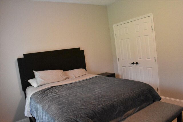 bedroom featuring baseboards