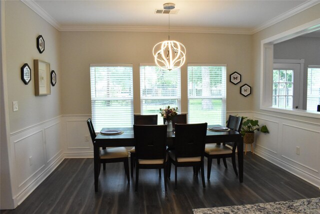 dining area featuring a notable chandelier, wainscoting, a decorative wall, visible vents, and dark wood-style floors