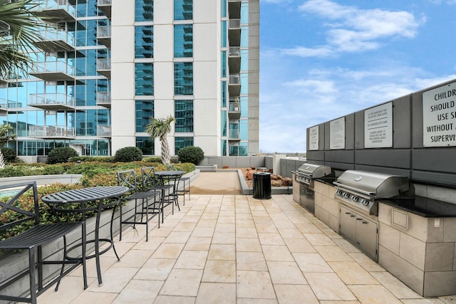 view of patio with exterior kitchen and grilling area