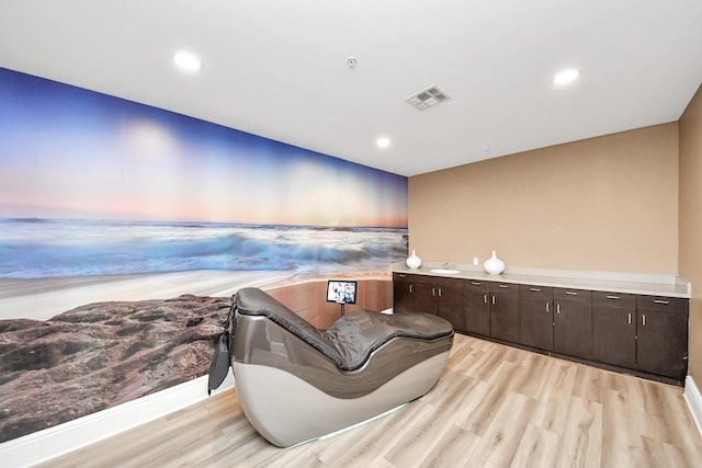 sitting room with recessed lighting, visible vents, and light wood-type flooring