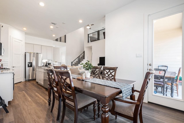 13716 Rising Sun Ln, Conroe, TX 77384 - dining area featuring dark wood-style flooring, stairway, and recessed lighting