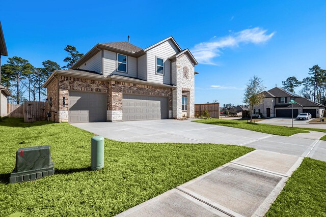 13716 Rising Sun Ln, Conroe, TX 77384 - traditional-style home with an attached garage, stone siding, and concrete driveway