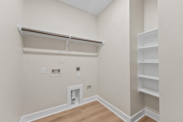 12341 N Chestnut Hills Dr, Conroe, TX 77303 - washroom with laundry area, wood finished floors, hookup for an electric dryer, washer hookup, and hookup for a gas dryer