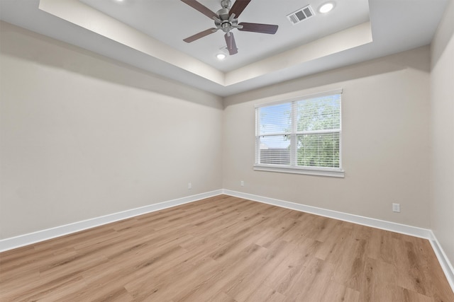 12341 N Chestnut Hills Dr, Conroe, TX 77303 - empty room with recessed lighting, baseboards, light wood-type flooring, a tray ceiling, and visible vents