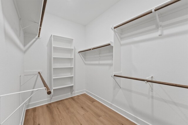 12341 N Chestnut Hills Dr, Conroe, TX 77303 - spacious closet featuring wood finished floors